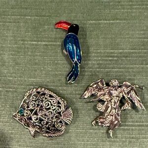 3 piece bundle of vintage Trifari brooches. 1 enamel bird, 1 fish, 1 Xmas angel!